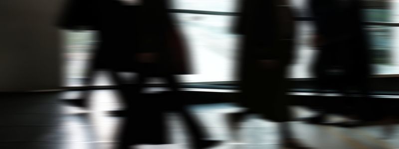 Abstract motion blur of city lights, representing dynamic movement.